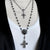 image showing the skull and rose rosary necklace styled with a longer rosary necklace